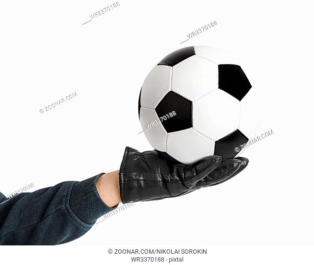 Goalkeeper hand and soccer ball isolated on white background