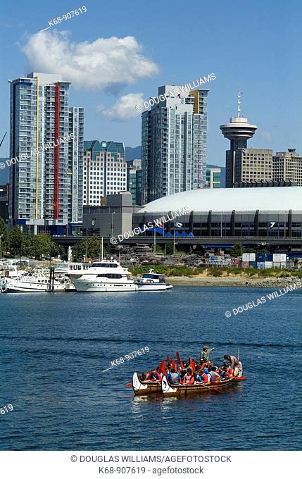 canoes in False Creek, with GM Place in background, Vancouver, BC, Canada.GM Place is a venue for the 2010 Winter Olympics