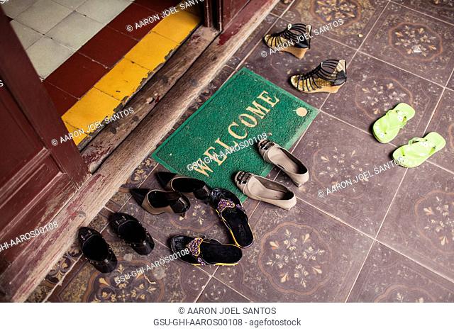 Welcome Mat and Shoes at Temple Entrance, Hanoi, Vietnam