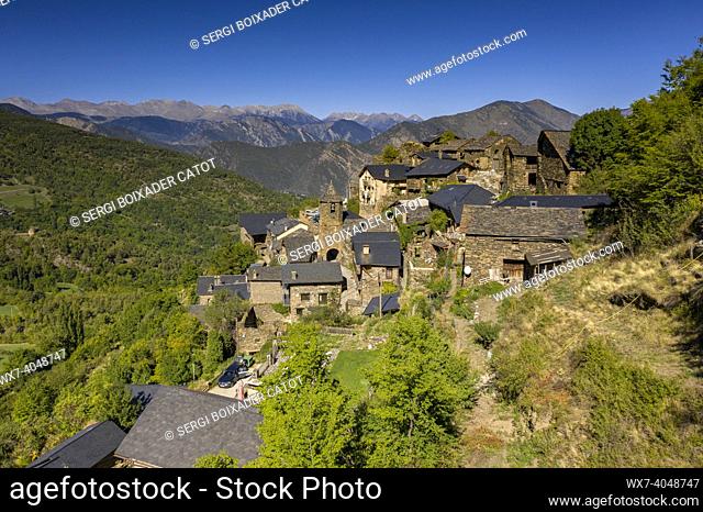 Aerial view of the town of Farrera and the surrounding green fields, in the Coma de Burg valley (Pallars SobirÃ , Lleida, Catalonia, Spain, Pyrenees)