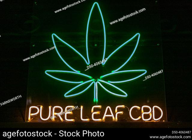 Budapest, Hungary A sign in a window for Pure Leaf CBD and a marijuana leaf