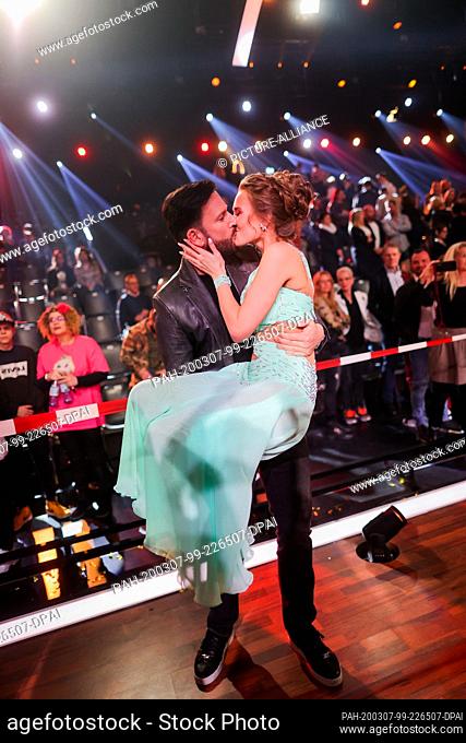 07 March 2020, North Rhine-Westphalia, Cologne: Laura Müller, TV personality, and her friend Michael Wendler, singer, hug each other after the RTL dance show...
