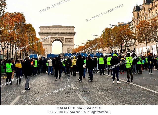 November 17, 2018 - Paris, France - Face to face police and protesters 'Yellow Vests' (Gilets Jaunes in french) in the avenue of Champs-Elysees in Paris during...