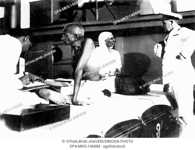 Mahadev Desai , Mahatma Gandhi , Mirabehn and the captain of SS Rajputana on their sojourn to England , September 1931 , India NO MR