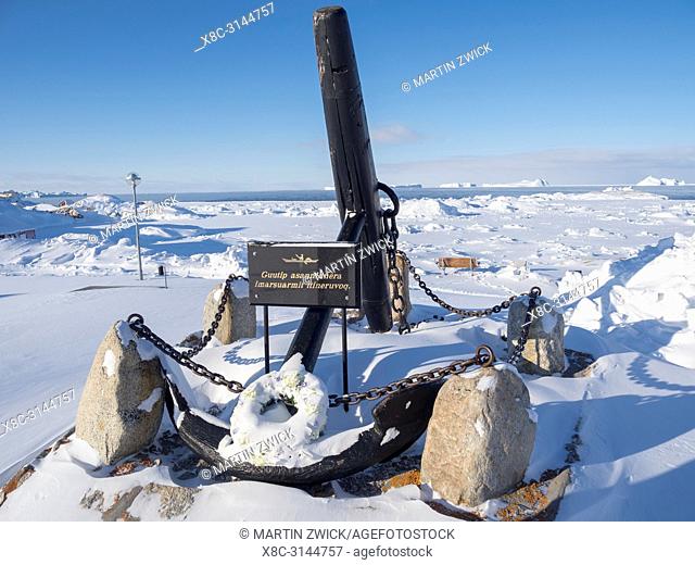 An anchor as a monument, near Zion s Church. Town Ilulissat at the shore of Disko Bay in West Greenland, center for tourism, administration and economy
