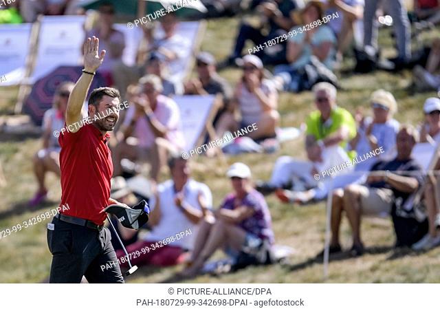 29 July 2018, Germany, Winsen: Golf: European Tour - European PGA Championship, Singles, Men, 4th round: Allen John from Germany celebrates his second place