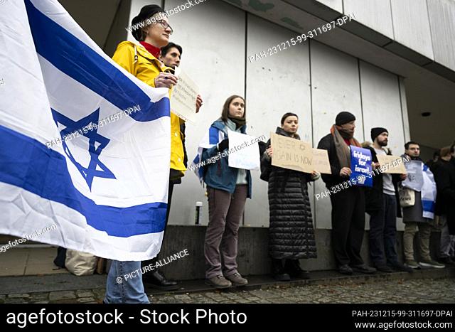 15 December 2023, Berlin: Participants in a Fridays for Israel demonstration stand in front of the entrance to the cafeteria of Freie Universität Berlin