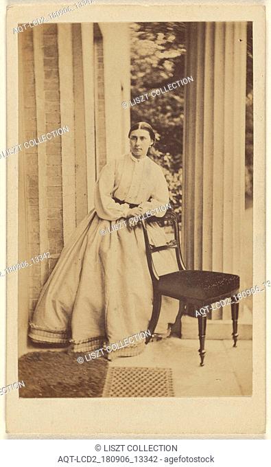 woman standing, leaning on chair back; J.G. & E.G. Short (British); 1865 - 1875; Albumen silver print