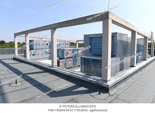 04 June 2019, Mecklenburg-Western Pomerania, Greifswald: Air conditioning technology is on the roof of the new building. Eleven months after the laying of the...