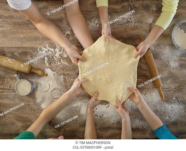 Overhead view of people making bread