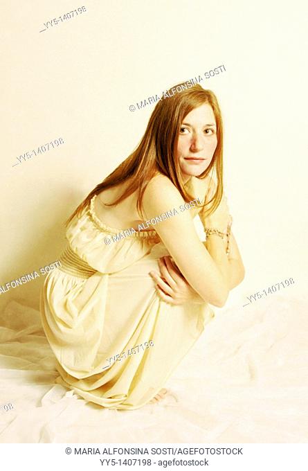 Caucasian young woman with white dress