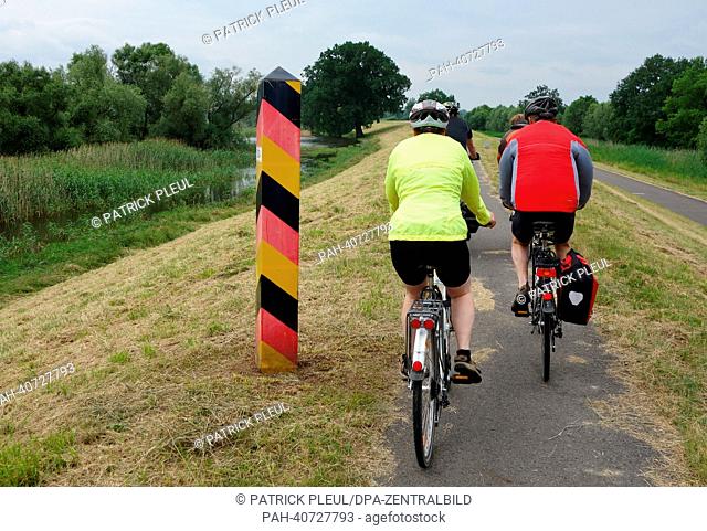 People cycle along the Oder-Neisse Cycle Path in Oderbruch, Germany, 29 June 2013. The Oder-Neisse Cycle Path is around 630 kilometers long and runs along the...