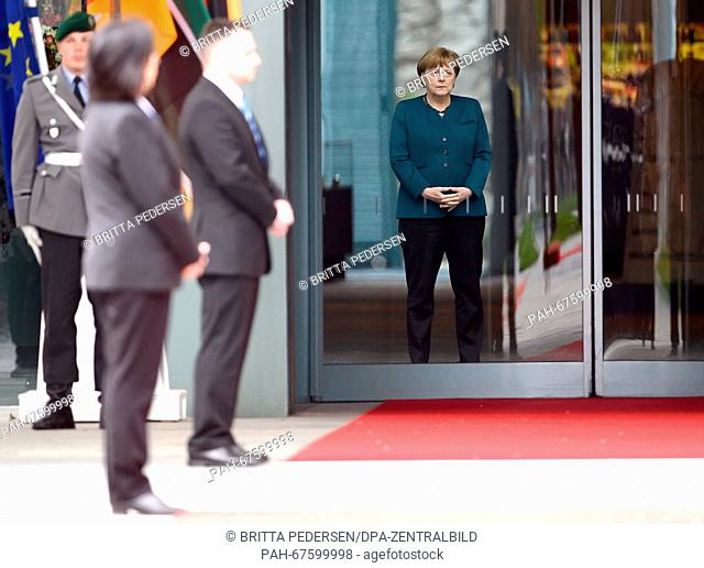 German Chancellor Angela Merkel awaits the arrival of Mozambican President Filipe Jacinto Nyusi (not pictured) in front of the Federal Chancellery in Berlin