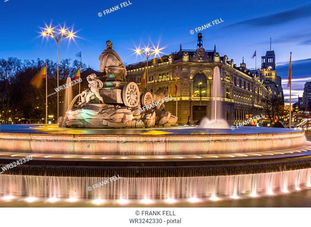 View of Cibeles Fountain in Plaza Cibeles and Calle de Alcala at dusk, Madrid, Spain, Europe