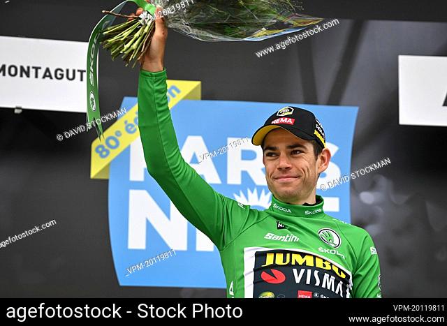 Belgian Wout Van Aert of Team Jumbo-Visma celebrates on the podium in the green jersey of leader in the sprint ranking after the fifth stage of 80th edition of...