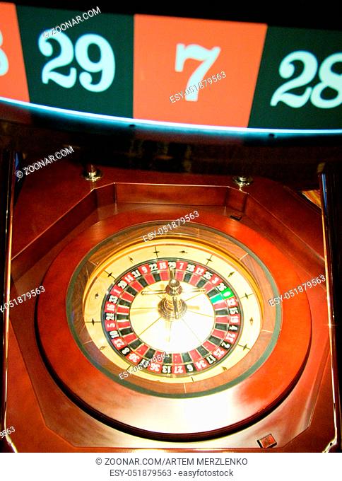 Golden Casino roulette, poker game, dice game, poker chips on a gaming table