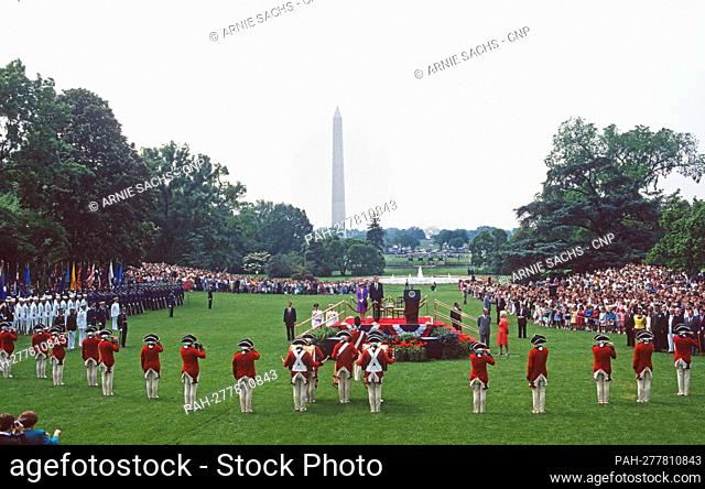 United States President George H.W. Bush and Queen Elizabeth II of Great Britain watch a performance of the “Old Guard Fife and Drum Corps” during a State...