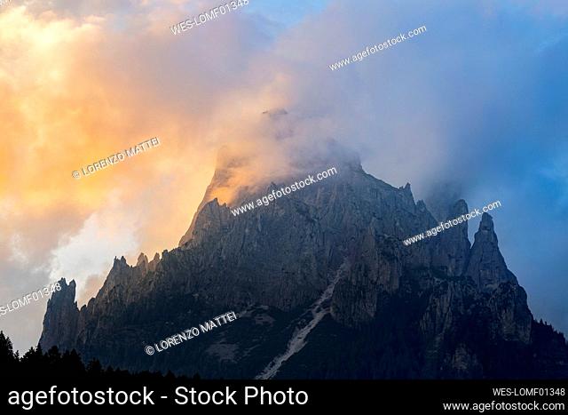 Italy, Trentino-Alto Adige, Clouds shrouding peak in Pale di San Martino range
