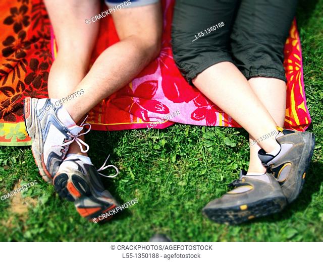 Couple lying on the grass. Spain