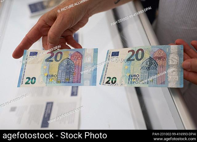 02 October 2023, Hamburg: A counterfeit 20-euro bill (r) and a cancelled genuine 20-euro bill are on display at the booth of the Federal Criminal Police Office...