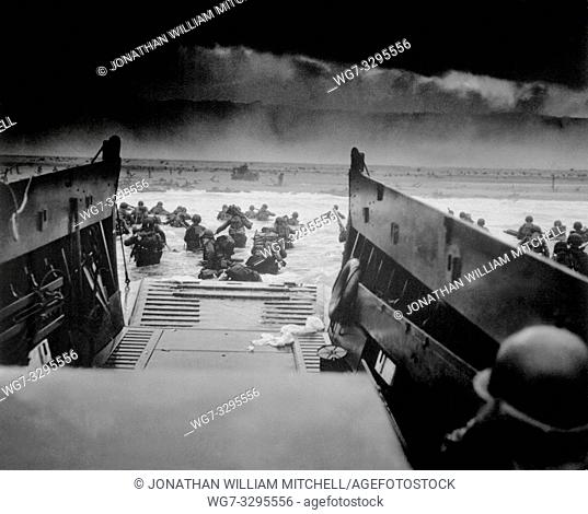 FRANCE Normandy -- 06 Jun 1944 -- Landing on the coast of France under heavy Nazi machine gun fire are these American soldiers
