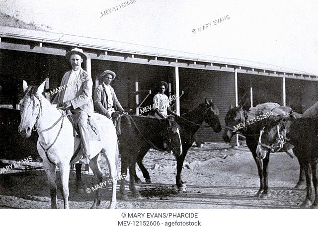 Mounted police constable and aborigine trackers starting out on a patrol