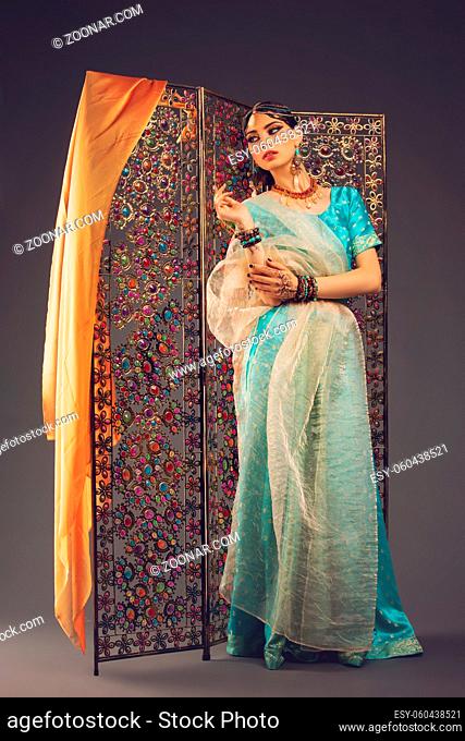 beautiful arabic style bride in ethnic clothes. studio shot. copy space