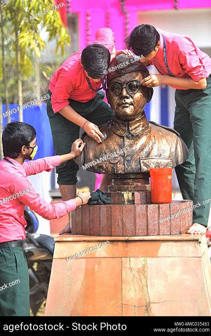 The school students of Netaji Subhas Vidyaniketan washed and cleaned the statue of Netaji Subhash on the eve of the birth anniversary of Indian nationalist