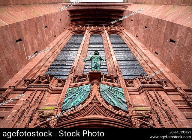LIVERPOOL, ENGLAND, DECEMBER 27, 2018: Entrance sculpture from outside of the Church of England Anglican Cathedral of the Diocese of Liverpool