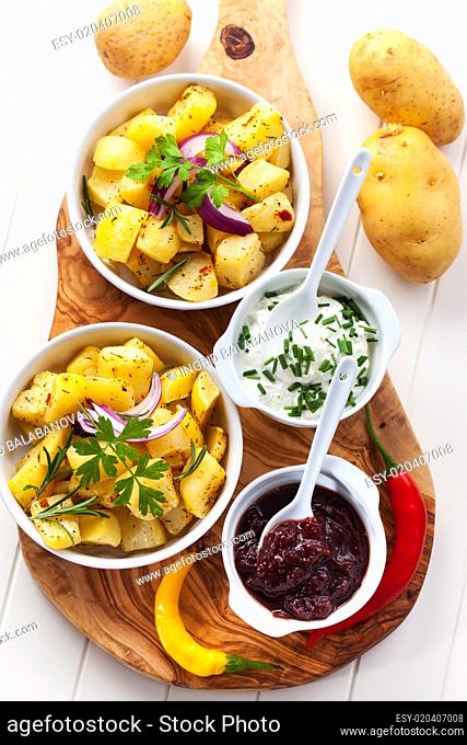 Baked potatoes with chutney and sour cream