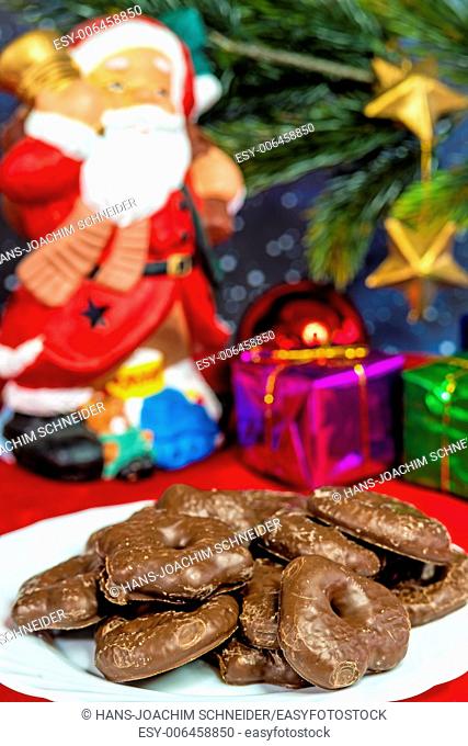 Santa Claus with German Christmas cakes Lebkuchen
