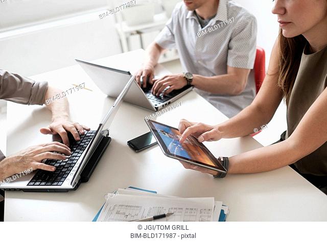 Business people using technology in office meeting