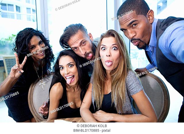 Business people making faces in office