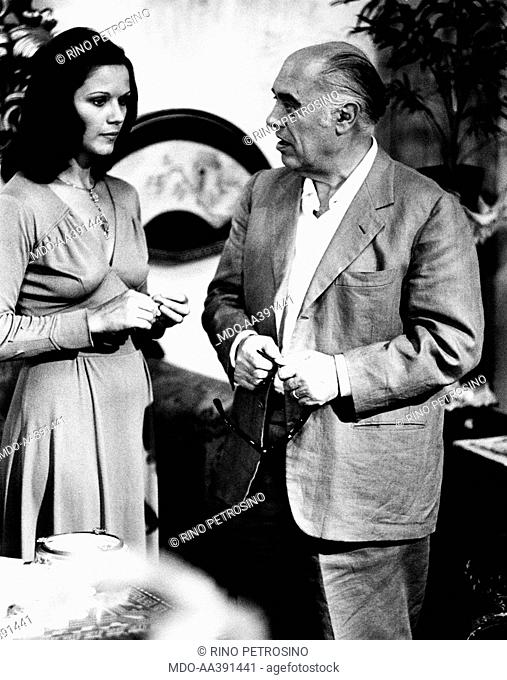 Agostina Belli and Carlo Ponti on the set of the film The Governess. Italian film producer Carlo Ponti talking to Italian actress Agostina Belli (Agostina Maria...