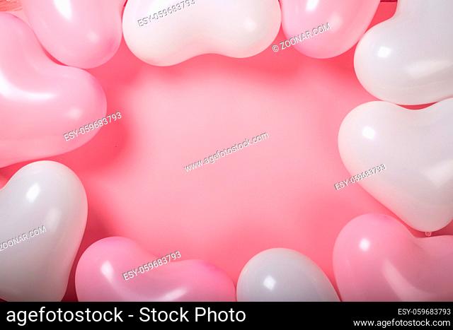 Happy valentines day greetings many heart shaped pink and white balloons background border frame flat lay with copy space for text