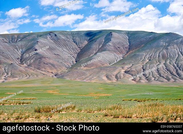 Mongolian mountain natural landscapes with eroded foothill slopes near lake Tolbo-Nuur in north Mongolia