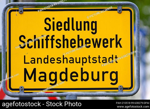 17 May 2021, Saxony-Anhalt, Magdeburg: ""Siedlung Schiffshebewerk Landeshauptstadt Magdeburg"" can be read on a place-entry sign