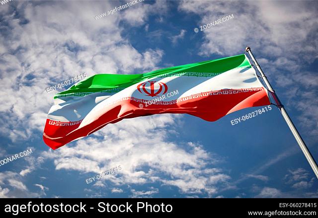 Beautiful national state flag of Iran fluttering at sky background. Low angle close-up Iran flag 3D artwork