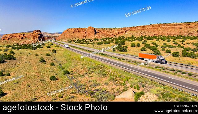 Vehilces Travel along close to the Laguna Pueblo along highway 40 in the desert southwest