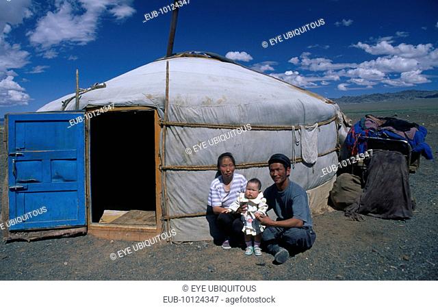 Family with one child by yurt