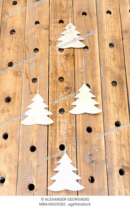 Christmas trees on a woodwork wall