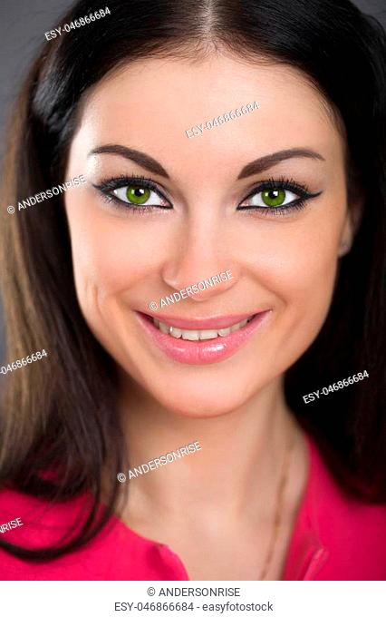 Close up portrait of beautiful young happy brunette woman with fresh and clean skin