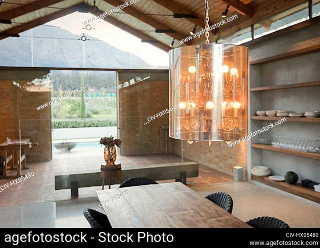 Home showcase interior chandelier over wood dining table