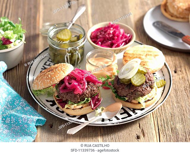 Beef burgers with caramelised onions and gherkins