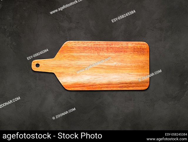 Wooden cutting board on concrete table background