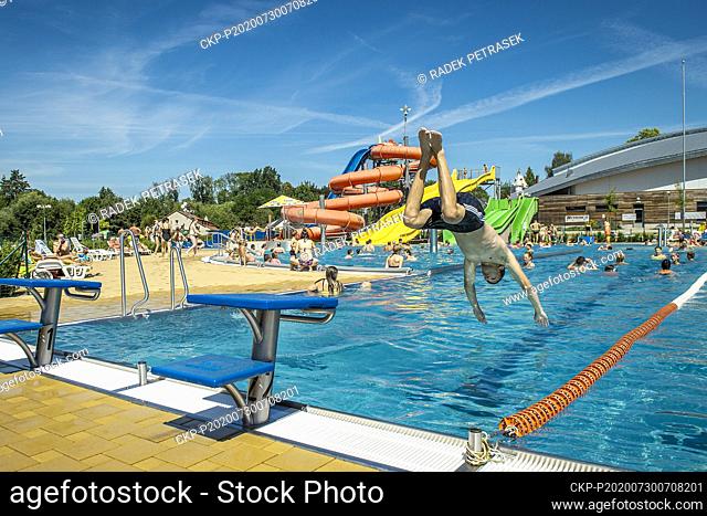 People enjoy hot weather in swimming pool aquapark Maskova zahrada in Turnov, Czech Republic, July 30, 2020. (CTK Photo/Radek Petrasek)