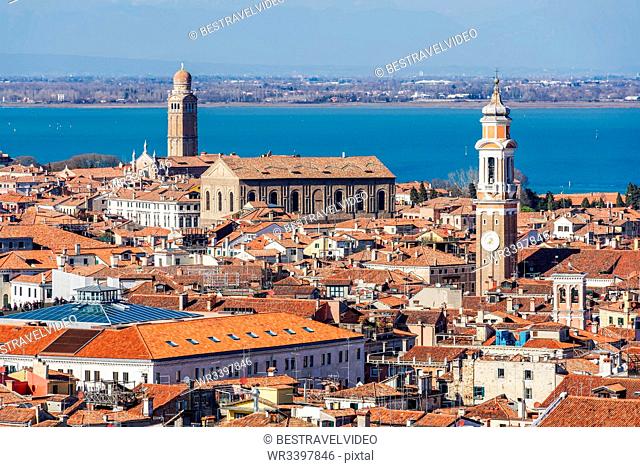 Rooftops panoramic day city north view with low rise buildings with red tiles, seen from St. Marks Campanile, Venice, UNESCO World Heritage Site, Veneto, Italy