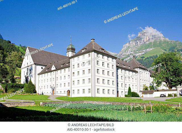 South facing view of Engelberg Abbey with mountain in background, a Benedictine monastery in Engelberg, Switzerland. Founded in 1120 it was destroyed by fire in...