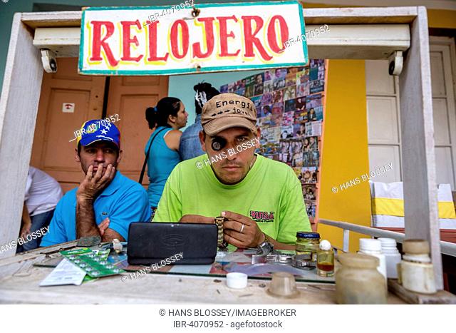 Watchmaker with their street workshop, Viñales, Pinar del Rio Province, Cuba
