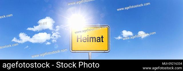 Shield 'Heimat' in front of sky with white clouds [M]